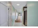 Inviting entryway featuring tile flooring that transitions to wood with an open view of the living area at 19029 Us Highway 19 N # 1-22, Clearwater, FL 33764