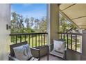 Cozy patio featuring comfortable seating and a peaceful view of the surrounding greenery and landscape at 3050 Landmark Blvd # 1008, Palm Harbor, FL 34684