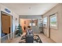 Cozy living room featuring tile floors and a pass-through to another room at 3515 18Th E St, Bradenton, FL 34208