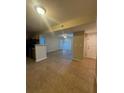 Open-concept living space featuring neutral tones, tiled flooring, and abundant natural light at 455 Alt 19 S # 217, Palm Harbor, FL 34683