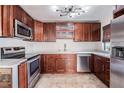 Well-equipped kitchen features stainless steel appliances, quartz countertops, and ample cabinet space at 12025 Environmental Dr # 5, New Port Richey, FL 34654