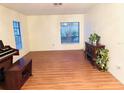 Bright living room features hard wood floors, natural light from large windows and plenty of room to make your own! at 15013 Redcliff Dr, Tampa, FL 33625