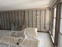 Spacious living room, ready for renovation, with ample natural light at 337 Rex Pl # B, Madeira Beach, FL 33708