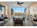 Spacious screened lanai featuring serene waterfront views and comfortable lounge seating at 7069 Key Haven Rd # 205, Seminole, FL 33777