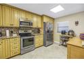 Bright kitchen with stainless steel appliances, granite countertops and tile flooring at 7300 Sun Island S Dr # 802, South Pasadena, FL 33707