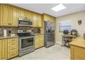 Bright kitchen with stainless steel appliances, granite countertops and tile flooring at 7300 Sun Island S Dr # 802, South Pasadena, FL 33707