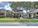 Charming two-story home with a landscaped front yard, mature trees, and inviting curb appeal in a desirable community at 8907 Ashford Gables, Tampa, FL 33626