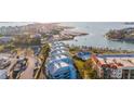 Beautiful aerial view highlighting the condos, boat docks, and waterfront at 1100 Pinellas Bayway S # H2, Tierra Verde, FL 33715