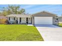 Lovely single-story home with a well-kept lawn and a spacious driveway at 1842 Oklahoma Ne Ave, St Petersburg, FL 33703