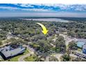 An aerial view showing neighborhood with yellow arrow pointing to property near water at 2234 23Rd S St, St Petersburg, FL 33712