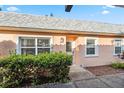 Charming home exterior featuring a well-maintained yard and inviting front entrance with white trim at 3829 Trophy Blvd, New Port Richey, FL 34655