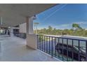 Outdoor patio with black railings overlooking the parking lot at 4650 Bay Blvd # 1012, Port Richey, FL 34668