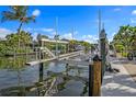 This image presents a dock with a boat lift, providing easy access to the water and secure watercraft storage at 520 74Th St, Holmes Beach, FL 34217