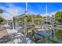 This image showcases a boat lift in a waterfront setting, providing convenient watercraft storage and access at 520 74Th St, Holmes Beach, FL 34217