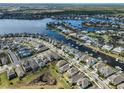 Expansive aerial showcases a beautiful waterfront community with numerous canals and luxurious homes at 5232 Wishing Arch Dr, Apollo Beach, FL 33572