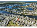 Stunning aerial of waterfront community with winding canals, lush landscaping, and beautiful homes at 5232 Wishing Arch Dr, Apollo Beach, FL 33572