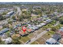 An aerial view of a residential neighborhood with mature landscaping and a home pinpointed at 6618 3Rd N Ave, St Petersburg, FL 33710