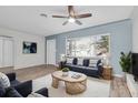 The cozy living room features neutral paint, laminate floors, and lots of natural light at 6618 3Rd N Ave, St Petersburg, FL 33710