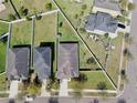 Aerial view of the property showcasing backyard with adjacent homes and fences providing a sense of community at 8220 Round Leaf Ln, Riverview, FL 33578