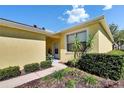 Inviting home entrance with a well-manicured garden, creating a warm and welcoming atmosphere at 11539 Captiva Kay Dr, Riverview, FL 33569