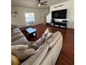 Spacious living room with hardwood floors and comfortable sectional sofa at 4632 Chatterton Way, Riverview, FL 33578