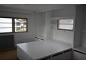 Cozy bedroom featuring built-in storage, shelving, and neutral décor at 4851 W Gandy Blvd # B5L19, Tampa, FL 33611