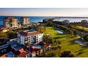 Aerial photo of the condo community and adjacent golf course, all with beautiful waterfront views at 6269 Palma Del Mar S Blvd # 111, St Petersburg, FL 33715