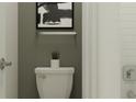 Bathroom with white toilet, grey walls, white subway tile in shower and framed artwork at 9640 Runaway Breeze Dr, Land O Lakes, FL 34637