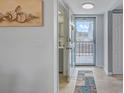 Inviting entryway with tile flooring and a view of the outdoors through a glass door at 10215 Regal Dr # 45, Largo, FL 33774