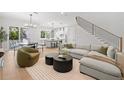 Stylish living room with open layout to the kitchen and dining area at 216 N Hesperides St, Tampa, FL 33609