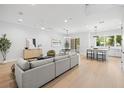 Spacious living room with contemporary furnishings and open layout to the kitchen at 216 N Hesperides St, Tampa, FL 33609