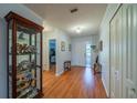 Inviting foyer with gleaming hardwood floors and ample closet space for convenient storage at 2720 Lancaster Dr, Sun City Center, FL 33573