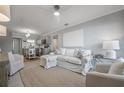 Comfortable living room adjacent to kitchen with plush seating and natural light at 2918 W Ellis Dr, Tampa, FL 33611
