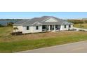 Scenic view of a charming home with waterfront access and meticulous landscaping at 3319 Gulf City Rd, Ruskin, FL 33570