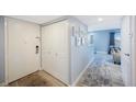 Hallway leading to living room and an entrance door with closet at 387 S Mcmullen Booth Rd # 16, Clearwater, FL 33759
