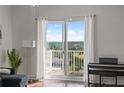 Relaxing balcony with large sliding glass doors and hardwood floors at 628 Cleveland St # 1507, Clearwater, FL 33755