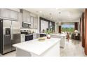 Modern kitchen with stainless steel appliances and granite counter tops at 746 Steel Dr, Apollo Beach, FL 33572