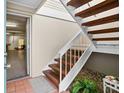 Interior stairwell with steps leading to a basement or lower level of the home at 12308 Sun Vista W Ct # 45, Treasure Island, FL 33706