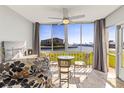 Cozy lanai with seating and a ceiling fan, offering serene waterfront views at 19029 Us Highway 19 N # 7-9, Clearwater, FL 33764