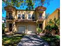 Stunning two-story home featuring a two-car garage and beautiful paver driveway at 418 S Habana Ave, Tampa, FL 33609