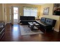 Cozy living room with comfortable seating and a bright, airy feel from the window at 425 Highland Ct, Dunedin, FL 34698