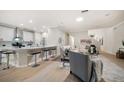 Bright open-concept living room featuring modern decor and a seamless flow into the kitchen at 434 Arch Ridge Loop # 434, Seffner, FL 33584