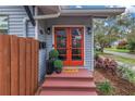Inviting entryway with red door and a 