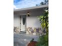 Close up of the entrance featuring a decorative glass door and attractive stone facade at 1214 Windsor Cir, Brandon, FL 33510