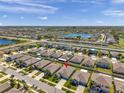 Aerial view of the property nestled in a well-planned community with nearby lakes and roadways at 1615 Redmond Brook Ln, Ruskin, FL 33570