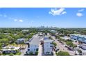Aerial view of modern condos with views of the city skyline and lush green trees under a blue sky at 15 29Th N St # Lot 7, St Petersburg, FL 33713