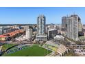 View of the high-rise condo in an urban area with cityscape, stadium and lush greenery at 301 1St S St # 1201, St Petersburg, FL 33701