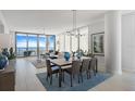 Bright and airy living and dining area with waterfront views and stylish furnishings at 301 1St S St # 1201, St Petersburg, FL 33701