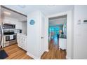 Open-concept kitchen with stainless steel appliances and a view into the living area at 420 64Th Ave # 907, St Pete Beach, FL 33706