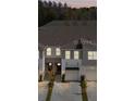A picturesque view of several townhomes, highlighting their architectural uniformity and appealing landscaping at 4212 Cloud Hopper Way, Lutz, FL 33559